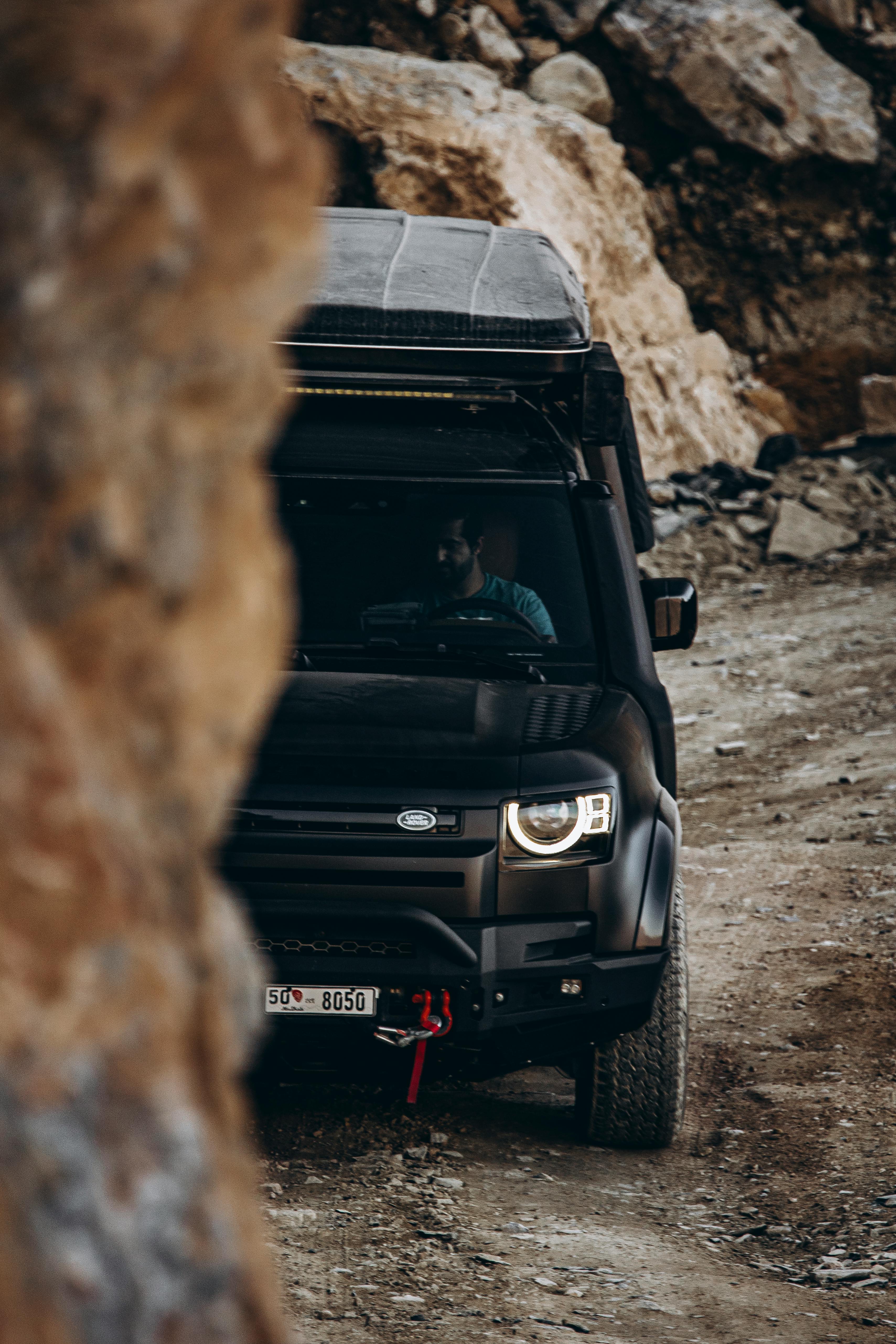 Black off-road vehicle on a rocky trail